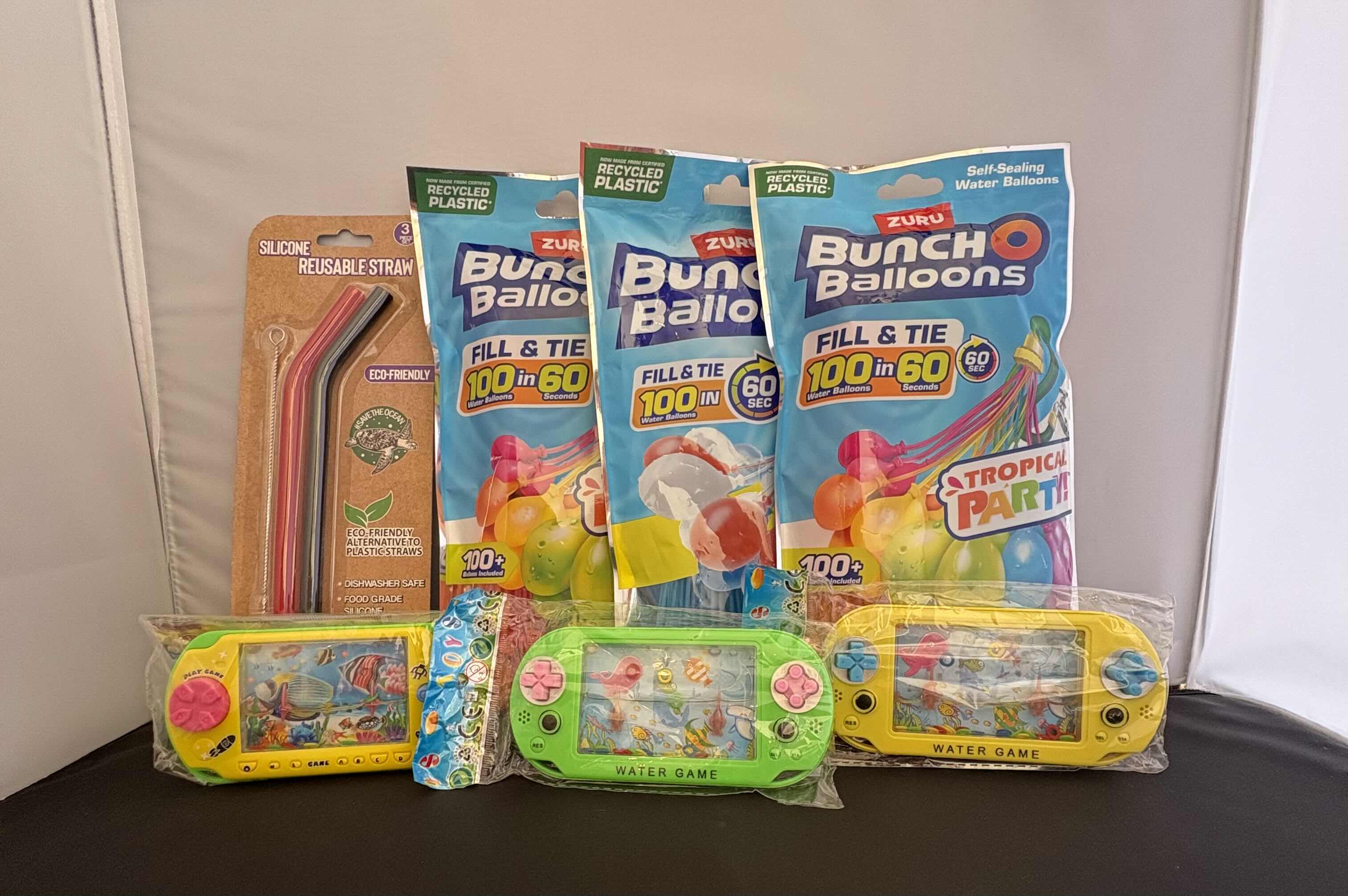 Photo 1 of BRAND NEW - ASSORTED LOT - INCLUDES 3 PACKS OF ZURU BUNCH O BALLOONS 100+ SELF-SEALING WATER BALLOONS, 3 WATER GAMES, 3 PIECE SET OF REUSABLE SILICONE STRAWS INCLUDES CLEANING BRUSH