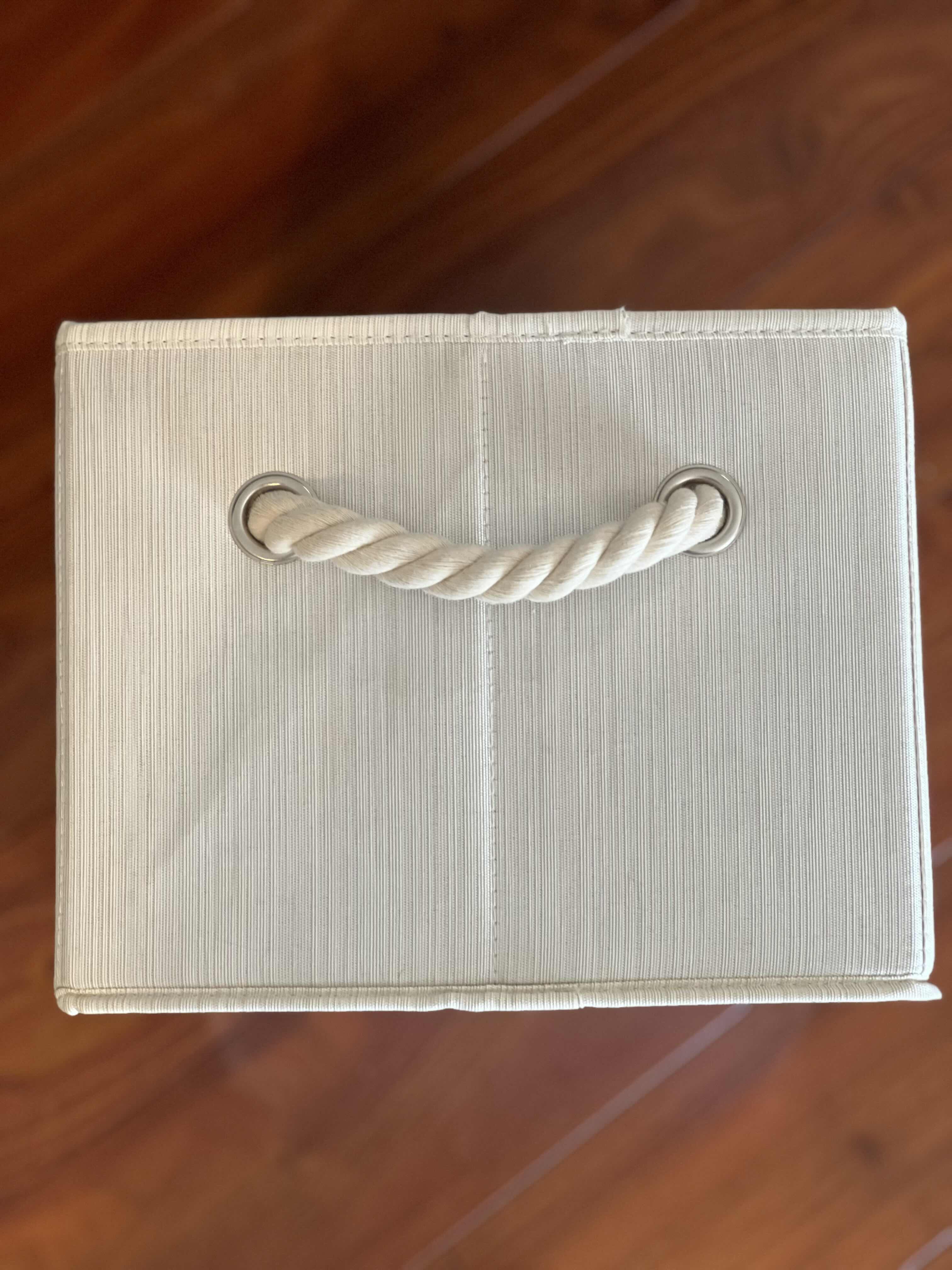 Photo 2 of 3-SET OF CANVAS DECORATIVE STORAGE BOXES. 15”L X 10”W X 8”H. GREIGE COLOR WITH NAUTICAL ROPE HANDLES ON BOTH ENDS. SUITABLE FOR CHANGING TABLES, BOOKCASES ETC.