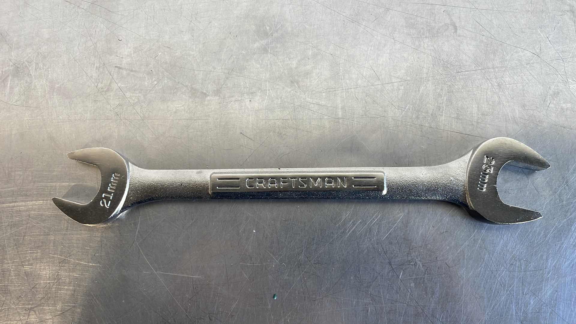Photo 1 of CRAFTSMAN OPEN END WRENCH 21MM AND 23MM USA