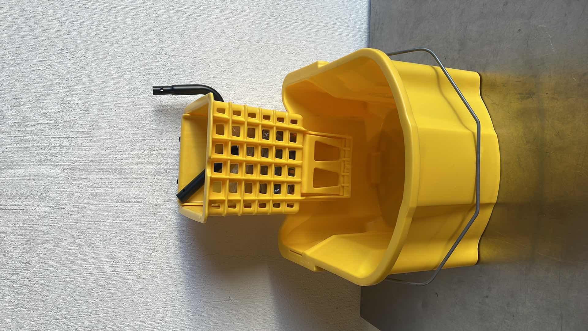 Photo 2 of GENUINE JOE MOP BUCKET WRINGER COMBO - 3'' CASTERS - 26 QT. - YELLOW