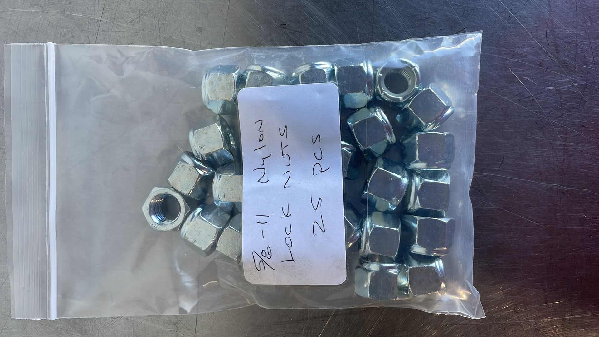 Photo 1 of 5/8-11 NYLON LOCK NUTS 25 PCS