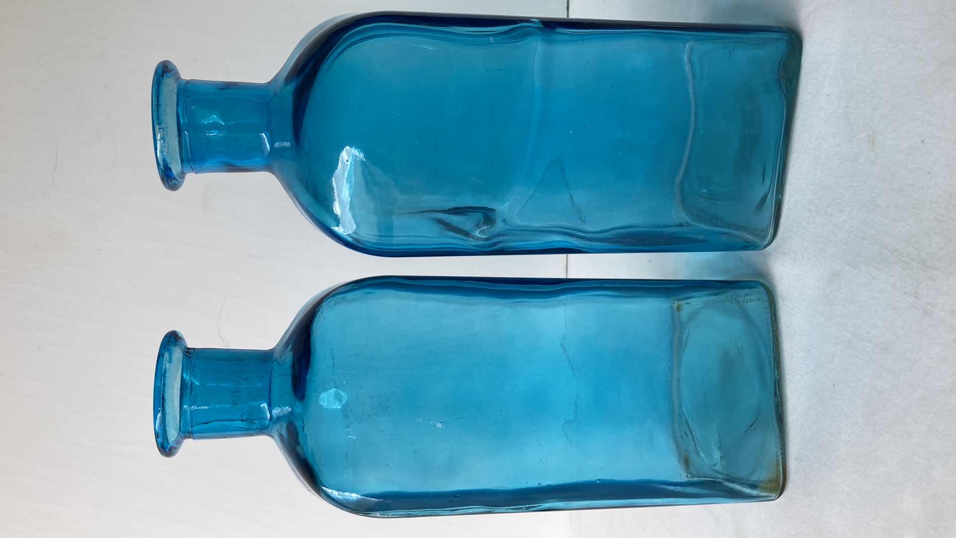 Photo 1 of TEAL CLEAR GLASS JUGS (2) 4” X 4” H11.25”