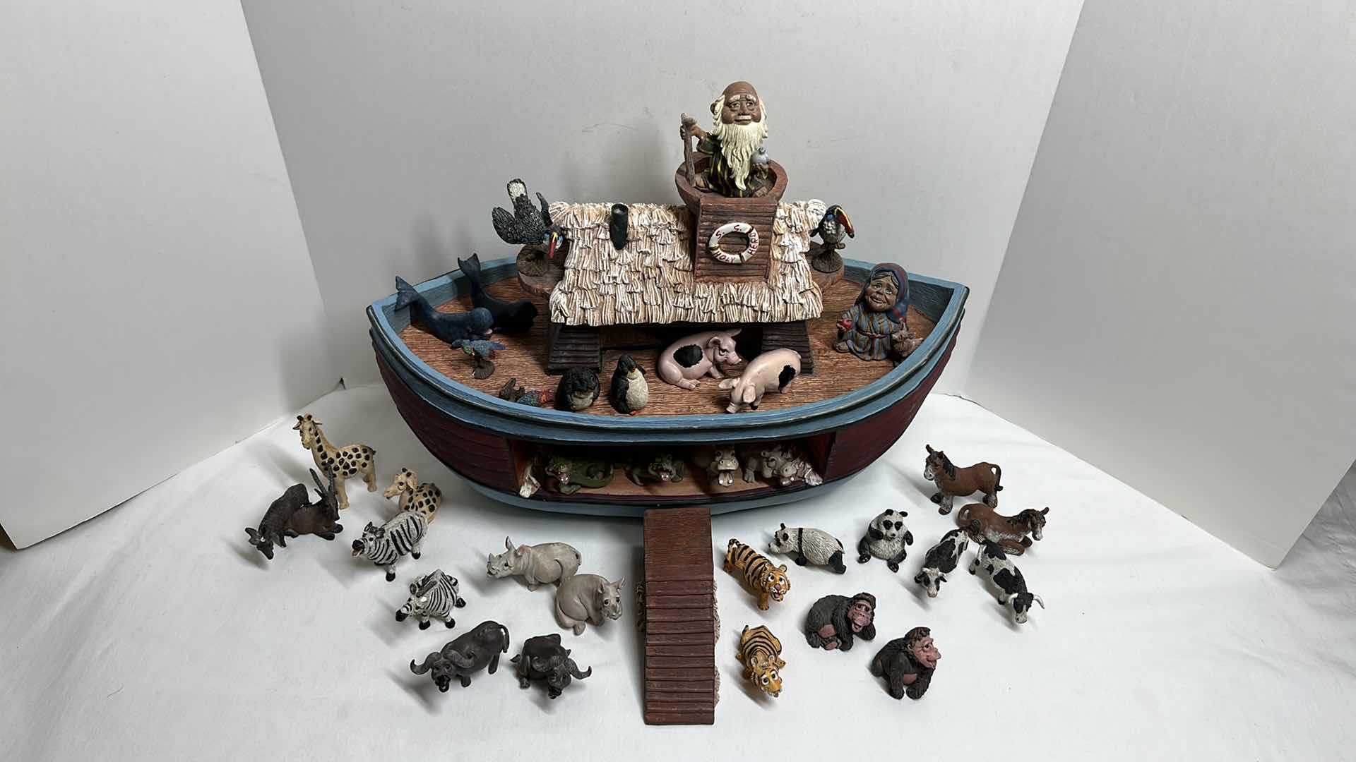 Photo 1 of NOAH’S ARK S.S. HOLY HERD COLLECTIBLES W NOAH & HIS WIFE & 34 ANIMAL FIGURINES 8.25” X 18.5” H12.5”