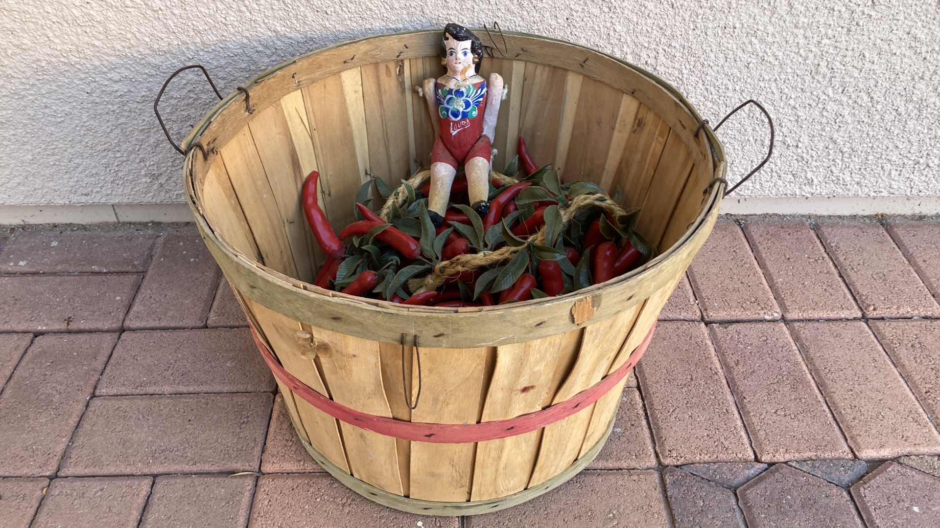 Photo 1 of WOOD BASKET 18” X 14” W PLASTIC CHILIES AND PAPIER-MACHE DOLL
