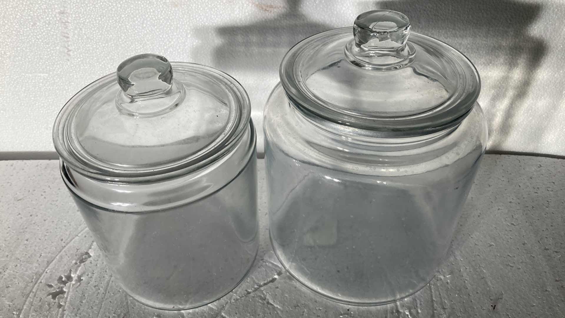 Photo 2 of CLEAR GLASS JARS W LIDS (2) 6”-7” X 8.5”-9.5”