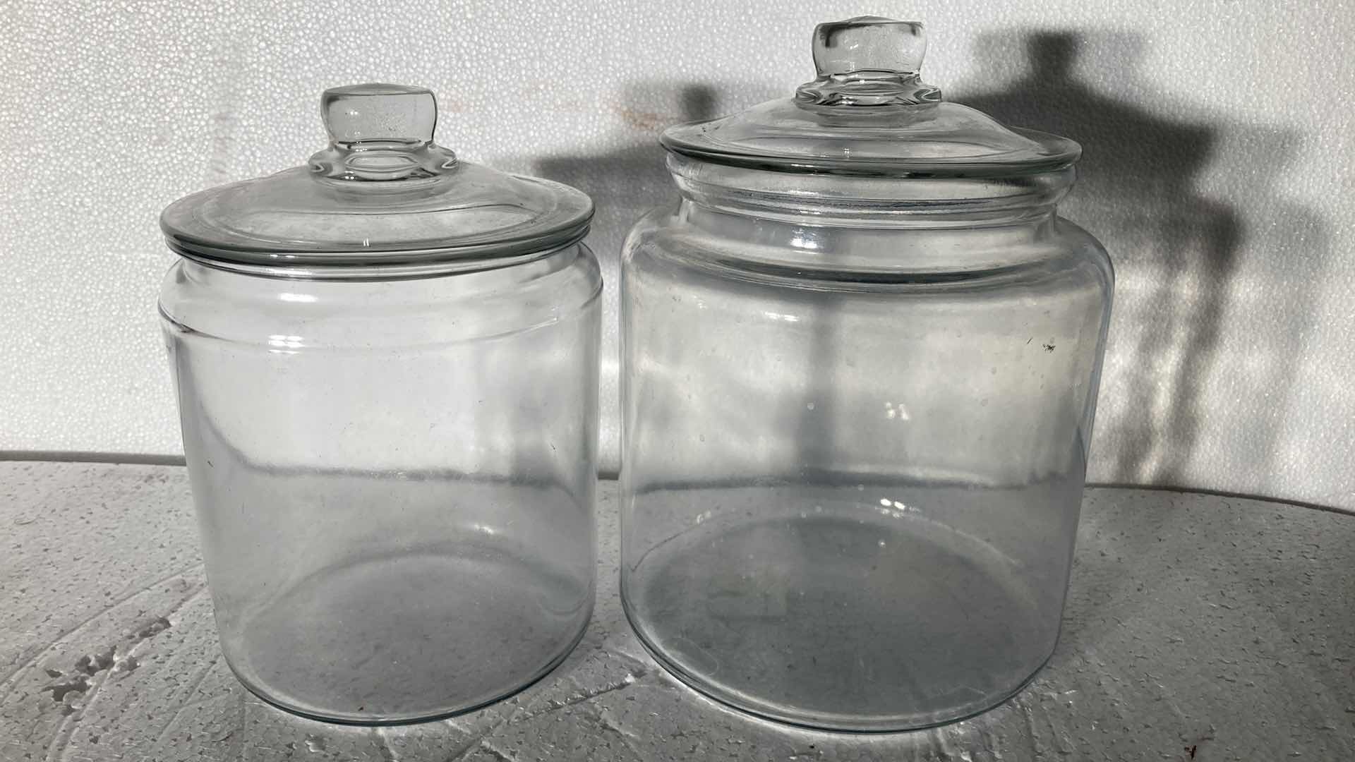 Photo 1 of CLEAR GLASS JARS W LIDS (2) 6”-7” X 8.5”-9.5”