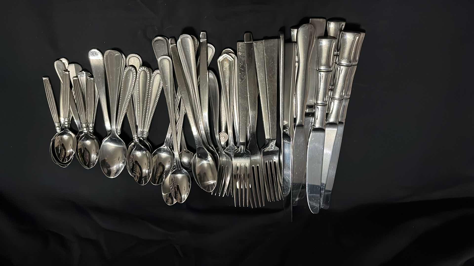 Photo 1 of STAINLESS STEEL FLATWARE, VARIOUS STYLES IN EACH UTENSIL, 10 OF EACH, 4.25” - 9.25” (50 PCS)