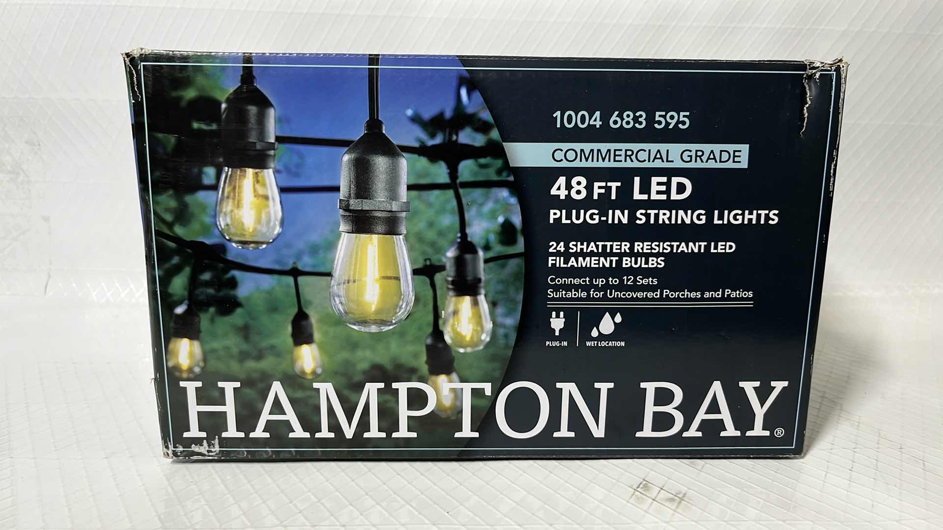 Photo 1 of HAMPTON BAY 48 FT COMMERCIAL GRADE LED PLUG-IN STRING LIGHTS, W 24 SHATTER RESISTANT FILAMENT BULBS (1004683595)