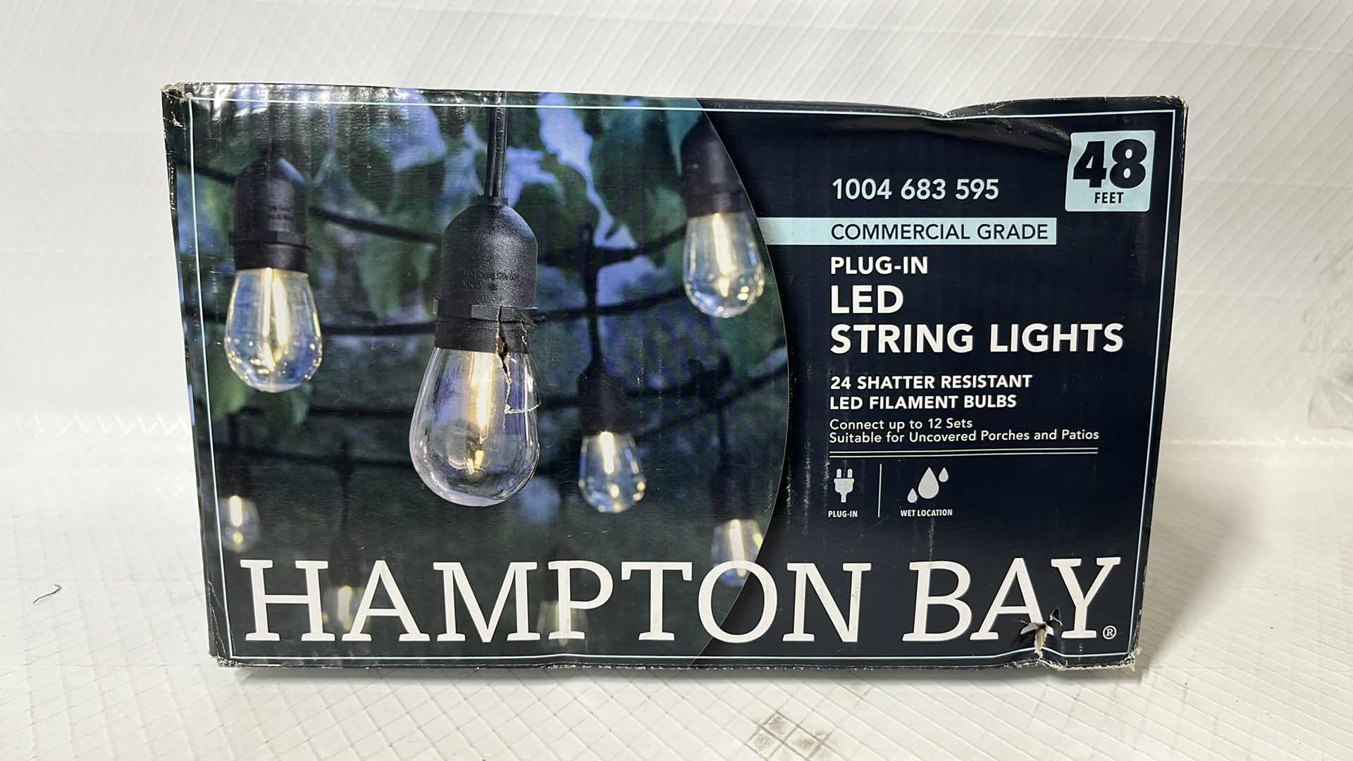 Photo 1 of HAMPTON BAY 48 FT COMMERCIAL GRADE LED PLUG-IN STRING LIGHTS, W 24 SHATTER RESISTANT FILAMENT BULBS (1004683595)