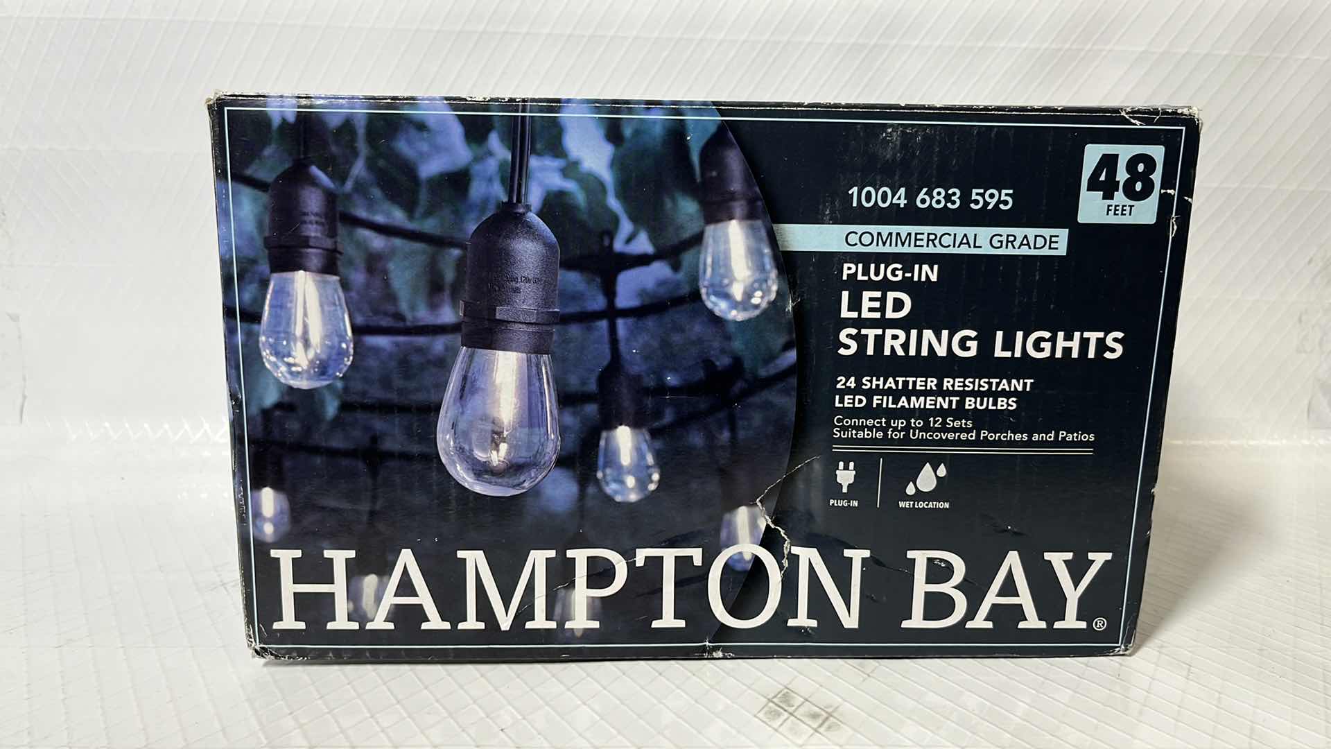 Photo 1 of HAMPTON BAY 48 FT COMMERCIAL GRADE LED PLUG-IN STRING LIGHTS, W 24 SHATTER RESISTANT FILAMENT BULBS (1004683595)