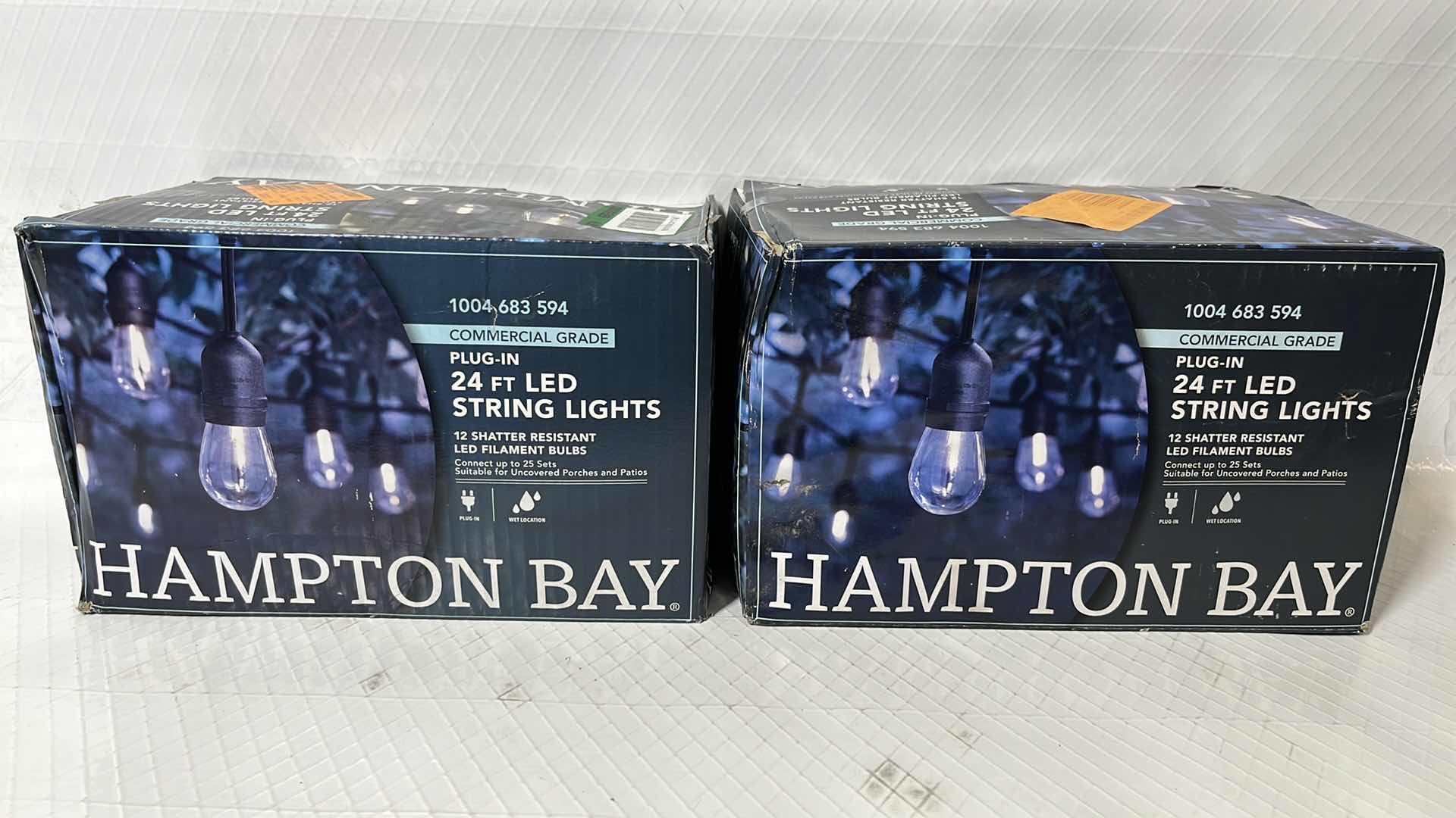 Photo 1 of 2- HAMPTON BAY 24 FT COMMERCIAL GRADE LED PLUG-IN STRING LIGHTS W 12 SHATTER RESISTANT FILAMENT BULBS (1004683594)