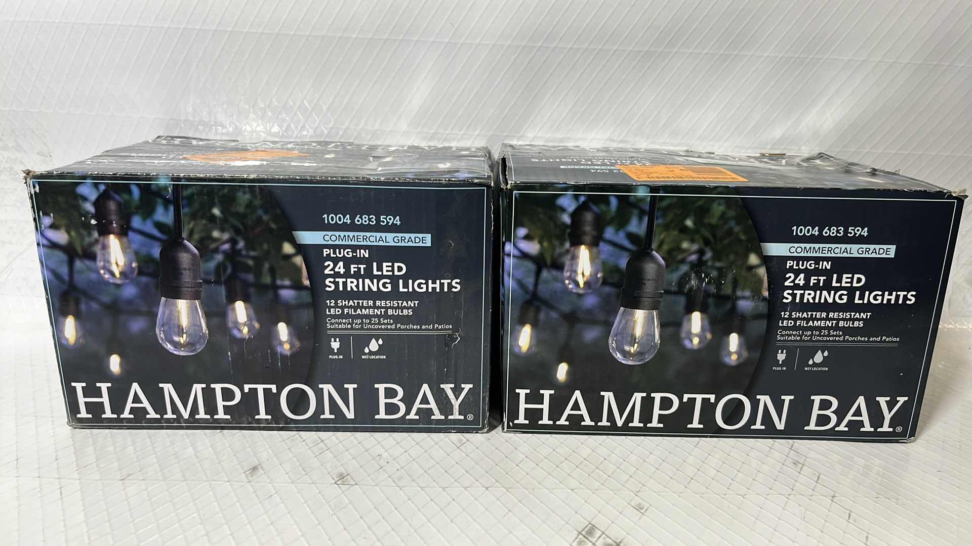 Photo 1 of 2- HAMPTON BAY 24 FT COMMERCIAL GRADE LED PLUG-IN STRING LIGHTS W 12 SHATTER RESISTANT FILAMENT BULBS (1004683594)