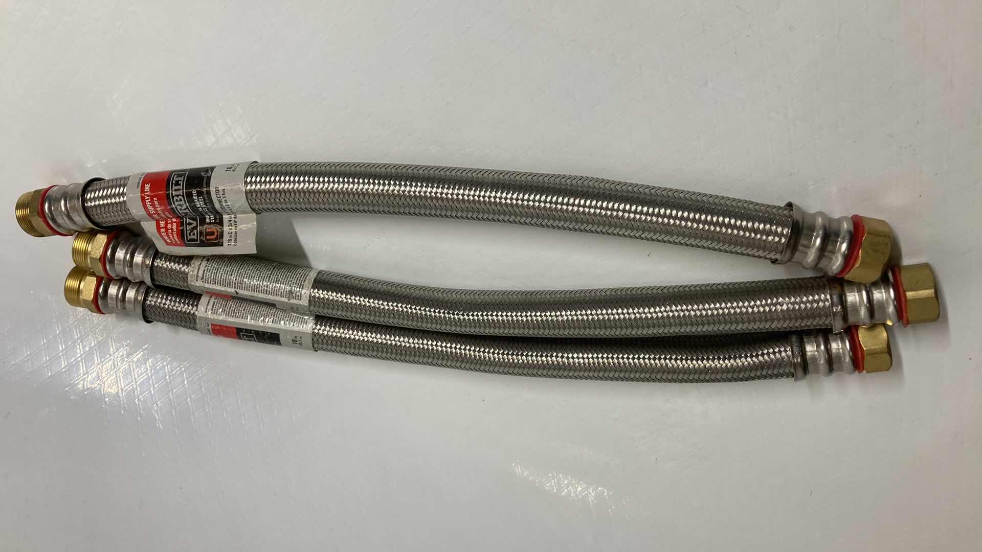 Photo 1 of NEW EVERBILT UNIVERSAL BRAIDED STAINLESS STEEL WATER HEATER SUPPLY LINE (3) 7/8” C 3/4” X 18”