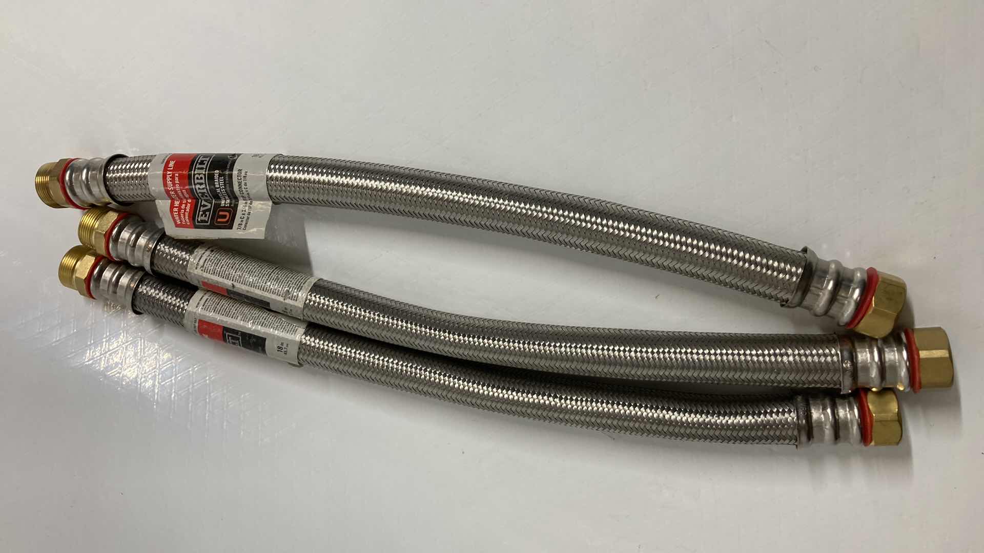 Photo 1 of NEW EVERBILT UNIVERSAL BRAIDED STAINLESS STEEL WATER HEATER SUPPLY LINE (3) 7/8” C 3/4” X 18”