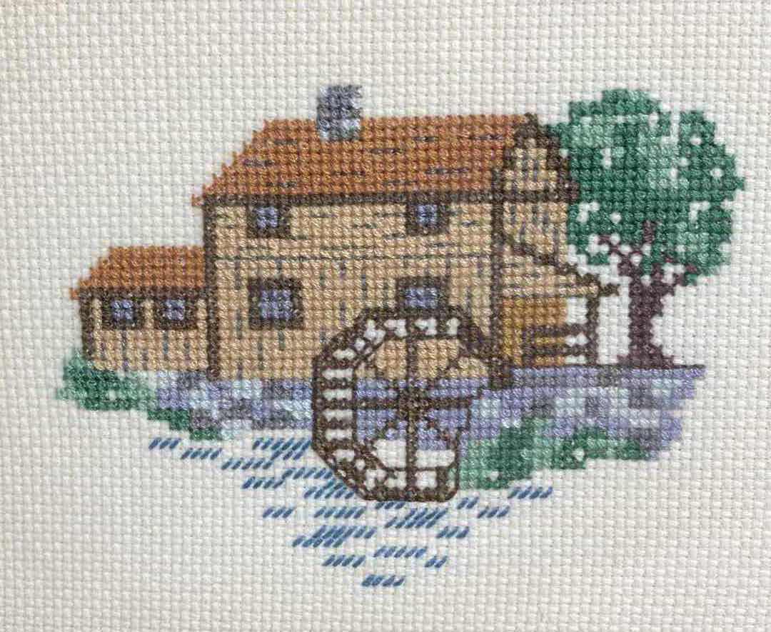 Photo 2 of MILL WHEEL HOUSE EMBROIDERY CROSS STITCH FRAMED ARTWORK BY LOCAL ARTIST 9” X 7.5”