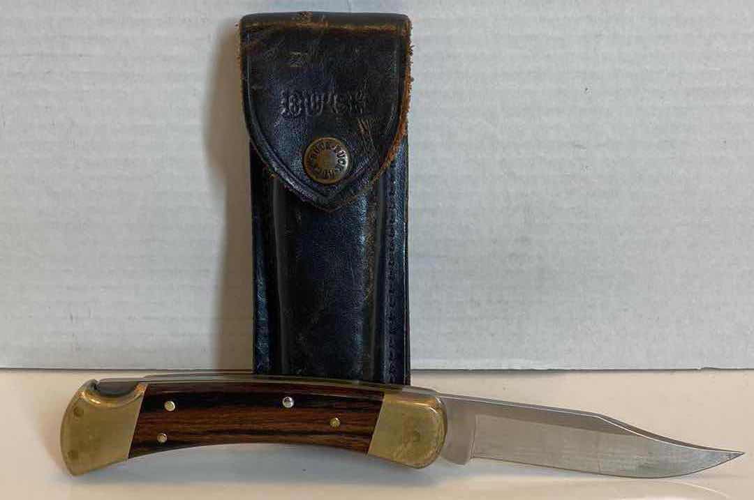 Photo 1 of BUCK 110 FOLDING KNIFE 3.75” W LEATHER SHEATH