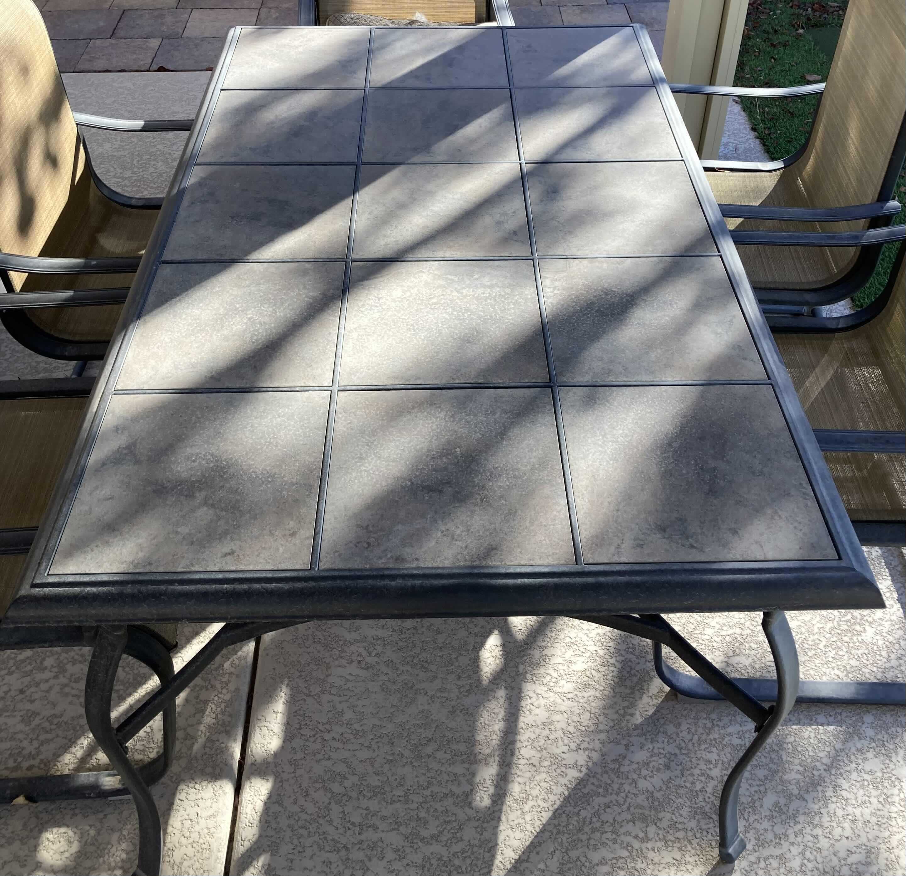 Photo 2 of HAMPTON BAY TILE TOP PATIO TABLE 64” X 40 H29” & 6 CHAIRS 22” X 24” H40”