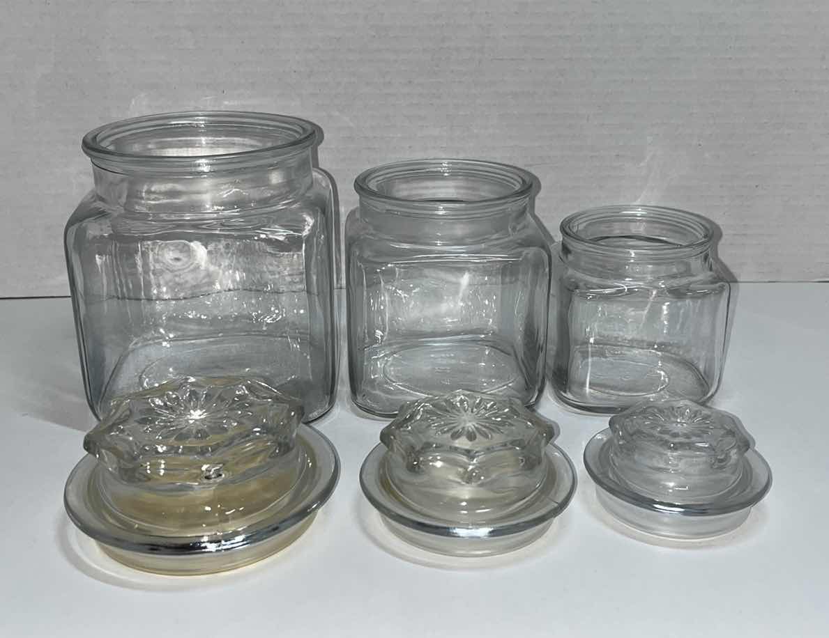 Photo 2 of CLEAR GLASS JAR SET W LIDS (3)