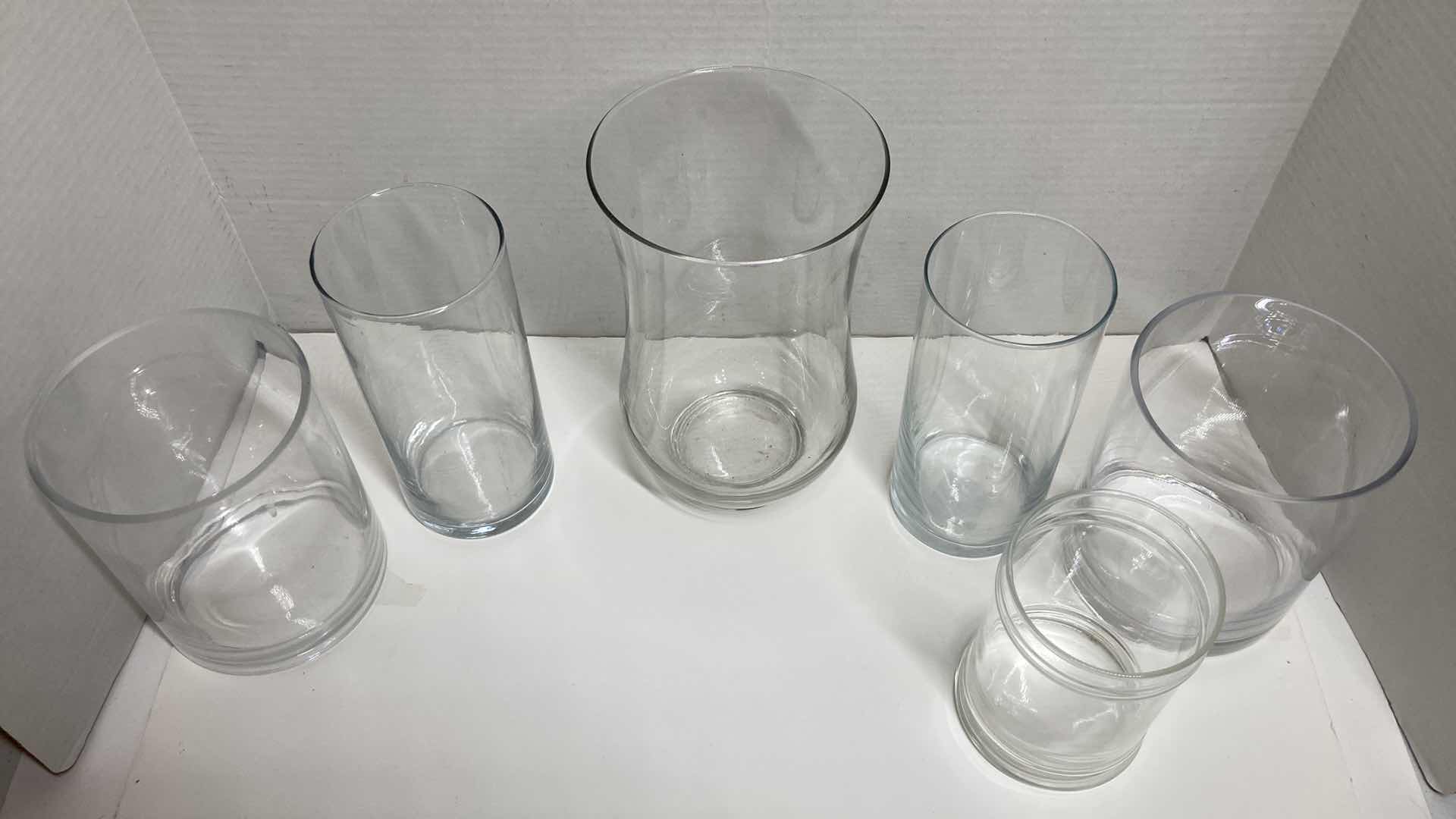 Photo 2 of CLEAR GLASS ROUND VASES (6)