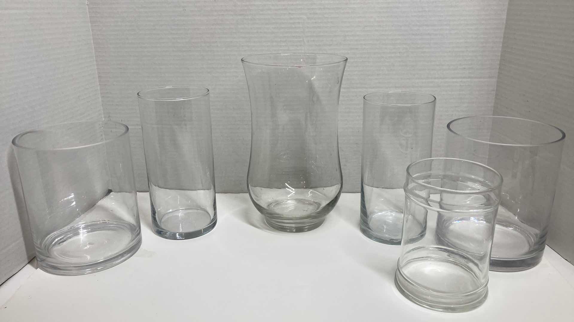 Photo 1 of CLEAR GLASS ROUND VASES (6)