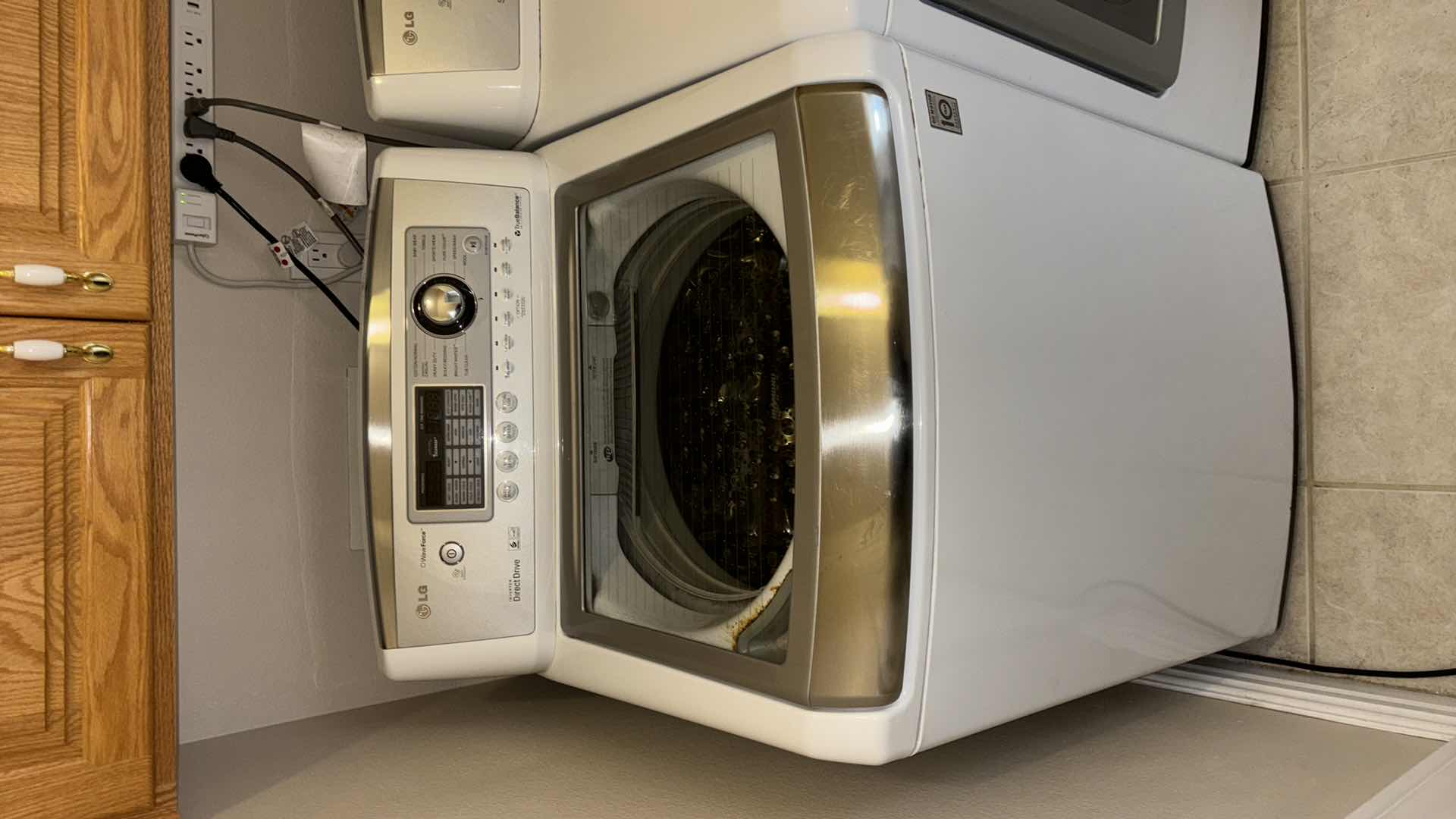 Photo 1 of LG 5.2 CU FT WAVE FORCE SERIES ULTRA LARGE CAPACITY HIGH EFFICIENCY TOP LOAD WASHING MACHINE (MODEL WT5001C)