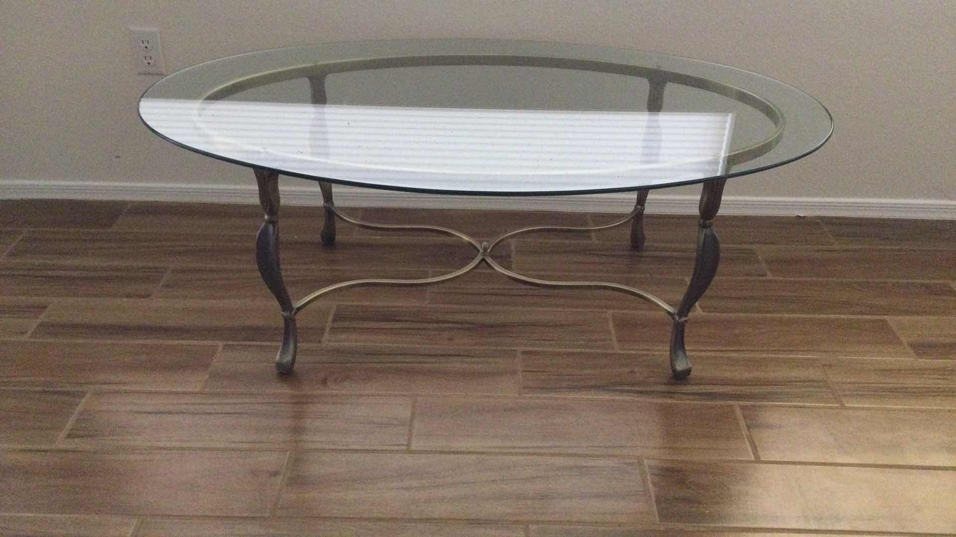 Photo 1 of COFFEE TABLE  SCULPTED METAL W/ GLASS TOP OVAL 52” X 33” H 18.5”