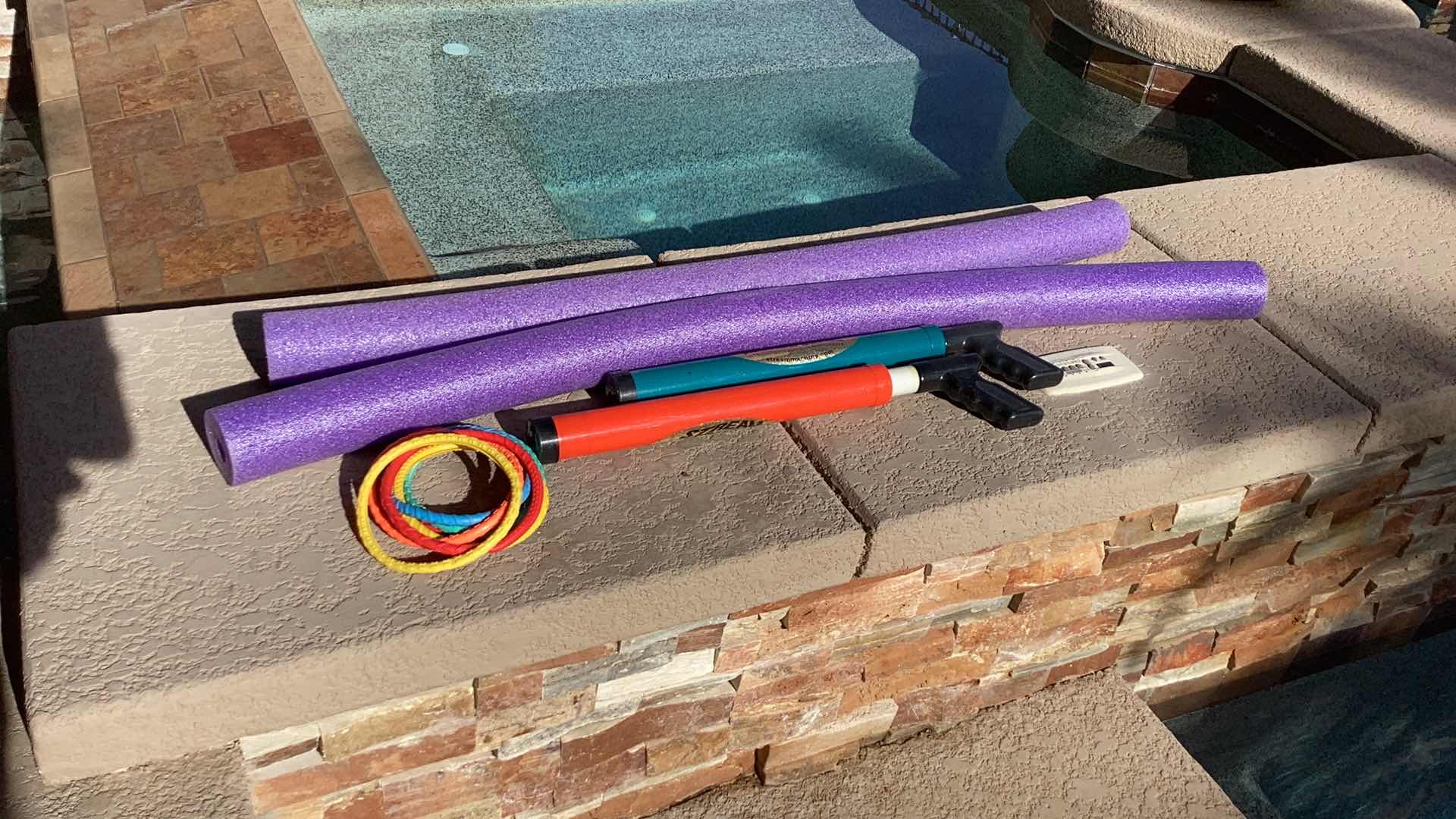 Photo 1 of POOL NOODLES AND TOY ASSORTMENT
