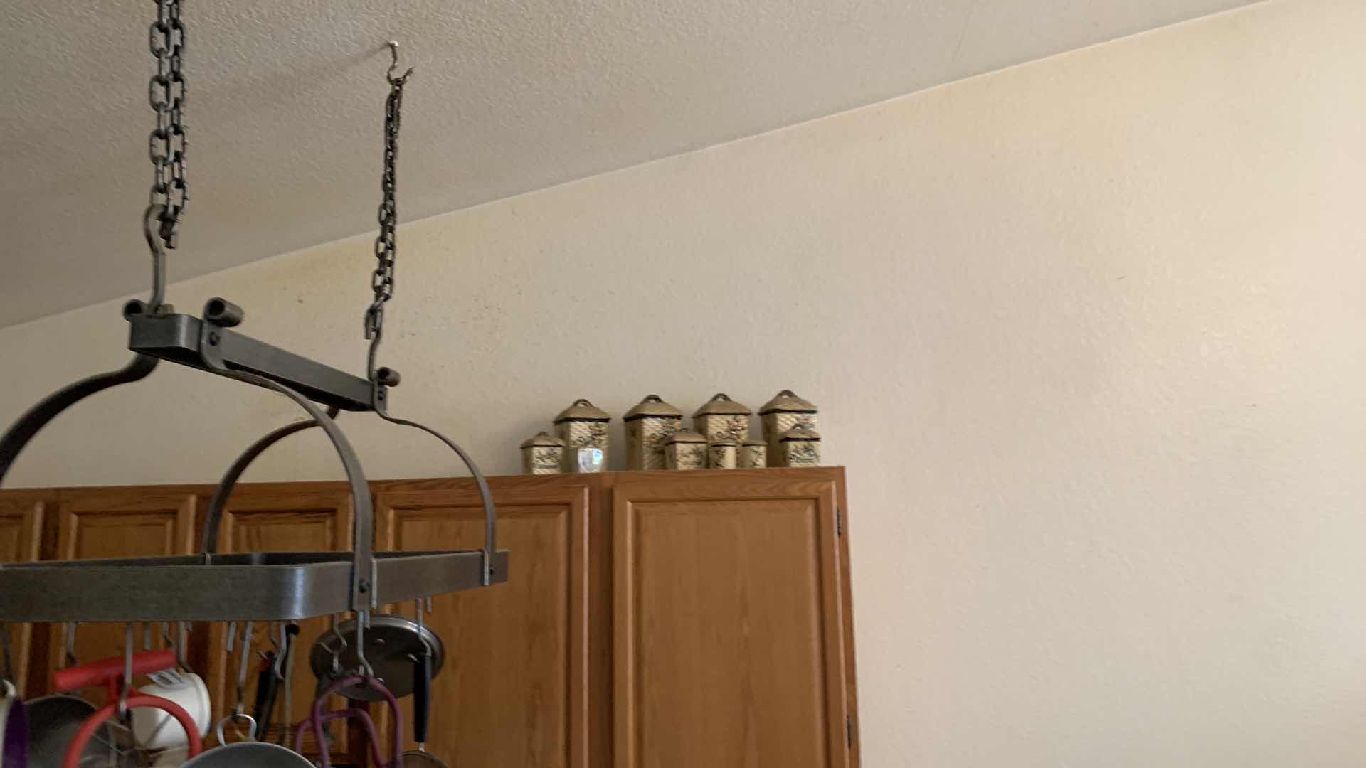 Photo 4 of HEAVY METAL HANGING POT RACK W ITEMS AND CANISTER SET (NOTE: BUYER TO REMOVE)