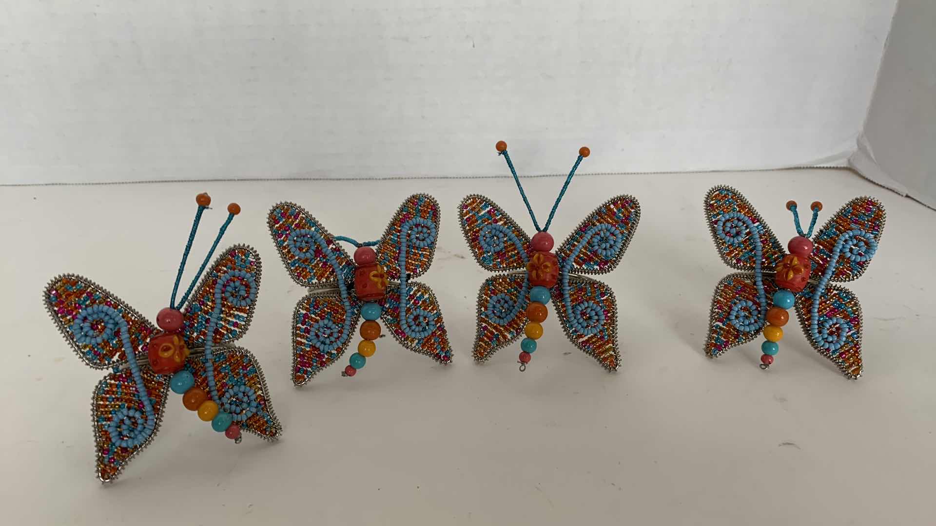 Photo 1 of 4-PIER ONE BEADED BUTTERFLY NAPKIN HOLDERS