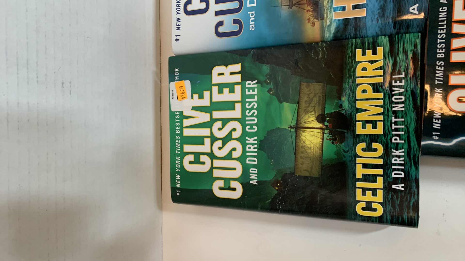 Photo 2 of 3-CLIVE CUSSLER HARD BACK BOOKS