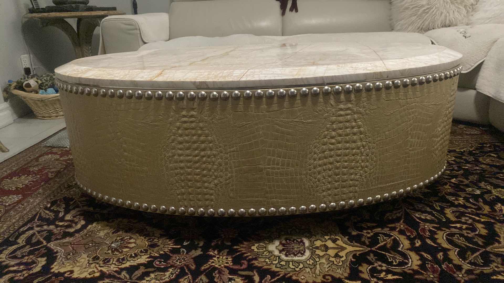 Photo 3 of FAUX CROCODILE AND MARBLE OVAL COCKTAIL TABLE WITH SILVER  STUDS FROM WYNN RESORT 54“ x 30“ H 19 1/2”