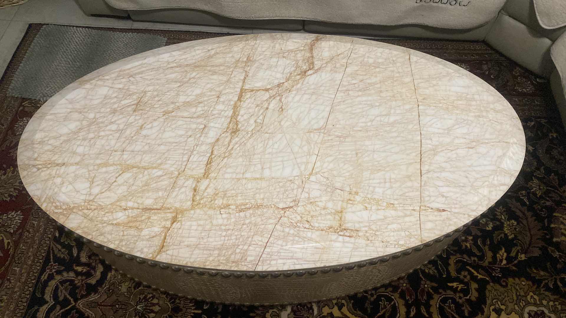 Photo 2 of FAUX CROCODILE AND MARBLE OVAL COCKTAIL TABLE WITH SILVER  STUDS FROM WYNN RESORT 54“ x 30“ H 19 1/2”