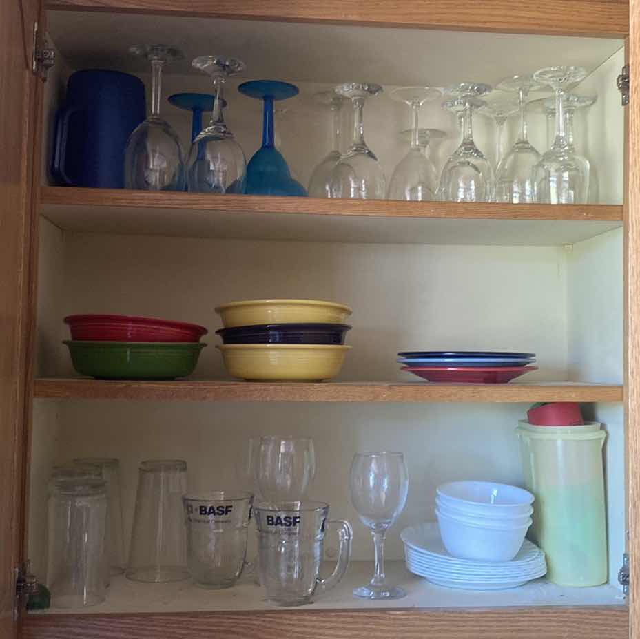 Photo 1 of CONTENTS OF KITCHEN CABINET - FIESTA PLATES & BOWLS & ASSORTED GLASSWARE