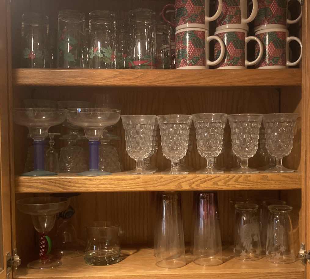 Photo 1 of CONTENTS OF KITCHEN CABINET - HOLIDAY MUGS & GLASSES, GLASSWARE