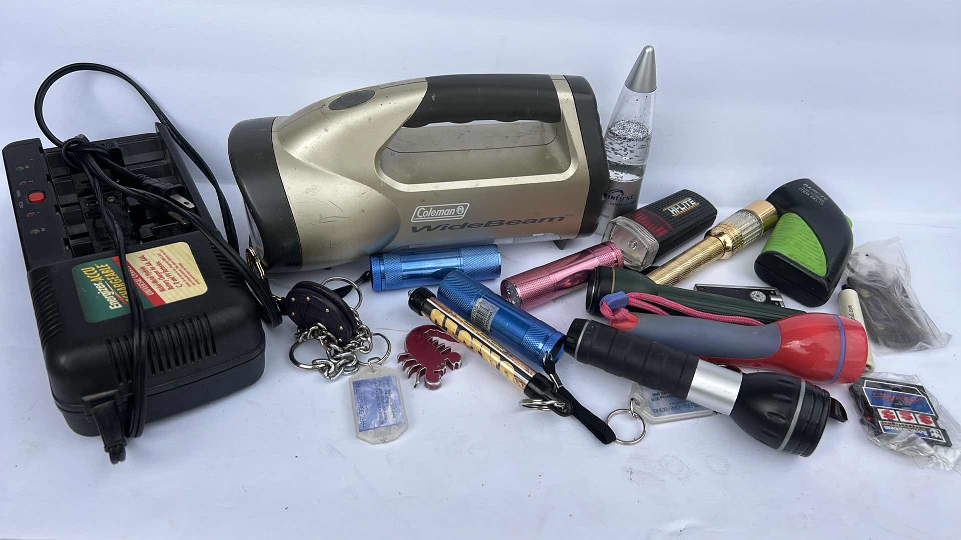 Photo 1 of FLASHLIGHTS, BATTERY CHARGER AND KEY CHAINS