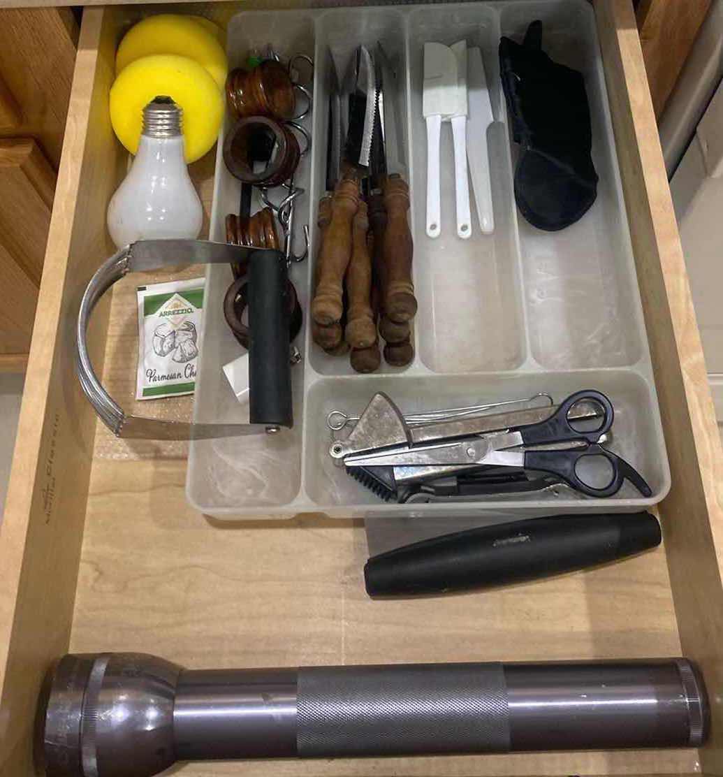 Photo 1 of CONTENTS OF KITCHEN CABINET- LARGE FLASHLIGHT & STEAK KNIVES