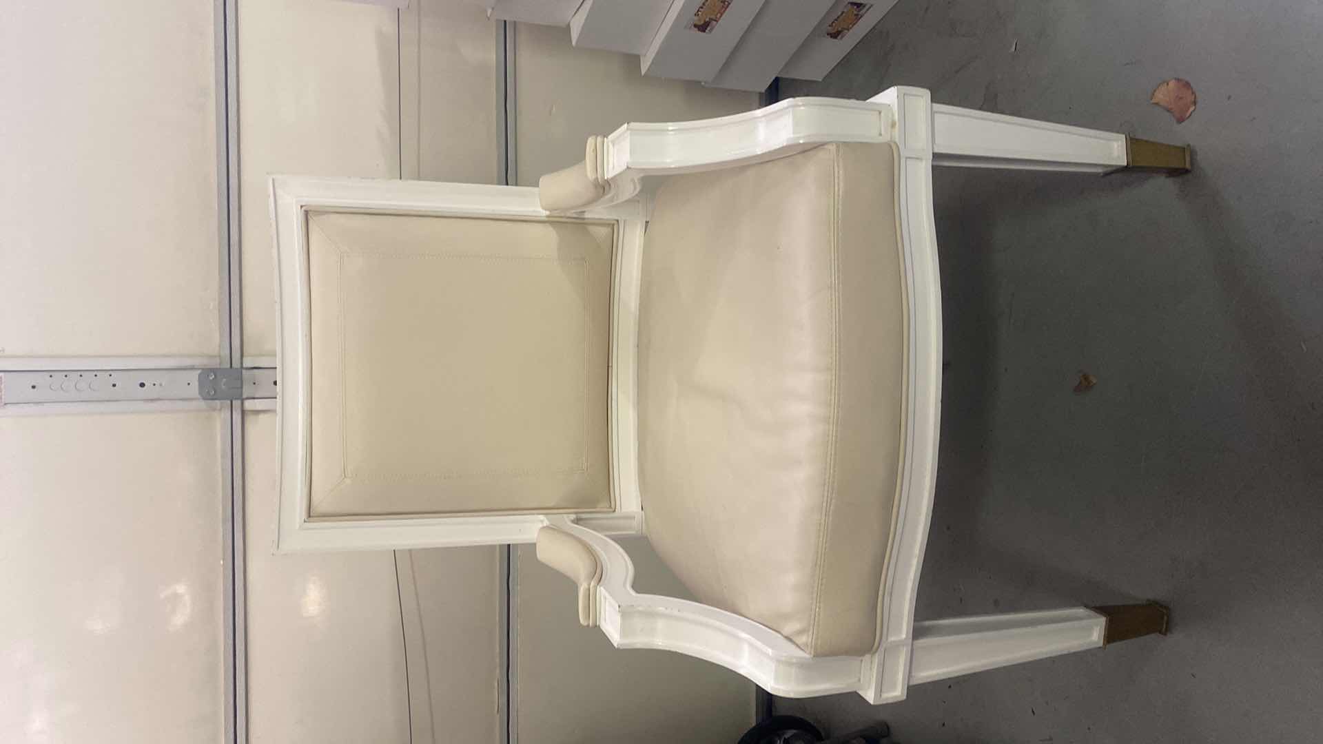 Photo 1 of BONDED LEATHER WITH WHITE WOOD AND GOLD TRIM ARMCHAIR FROM WYNN RESORT