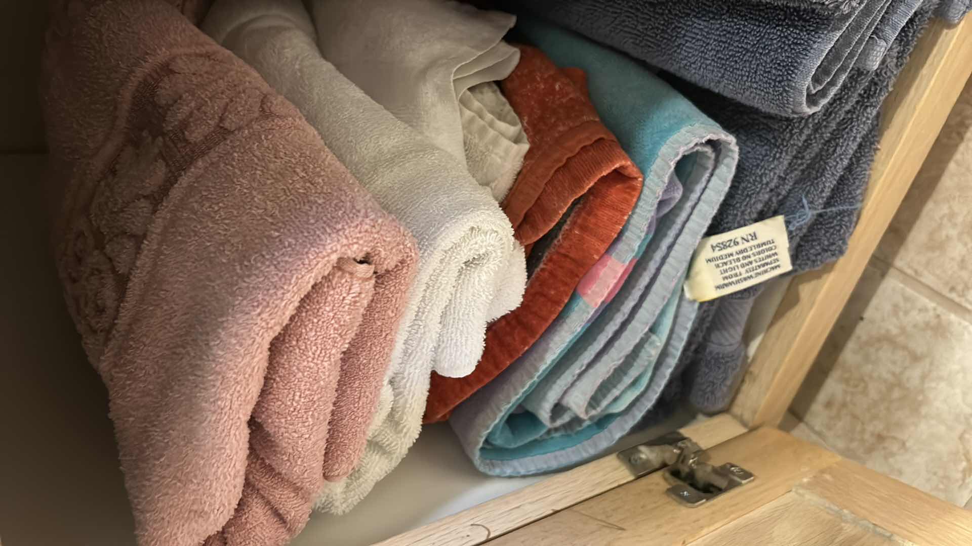 Photo 1 of CONTENTS OF CABINET IN UPSTAIRS BATHROOM