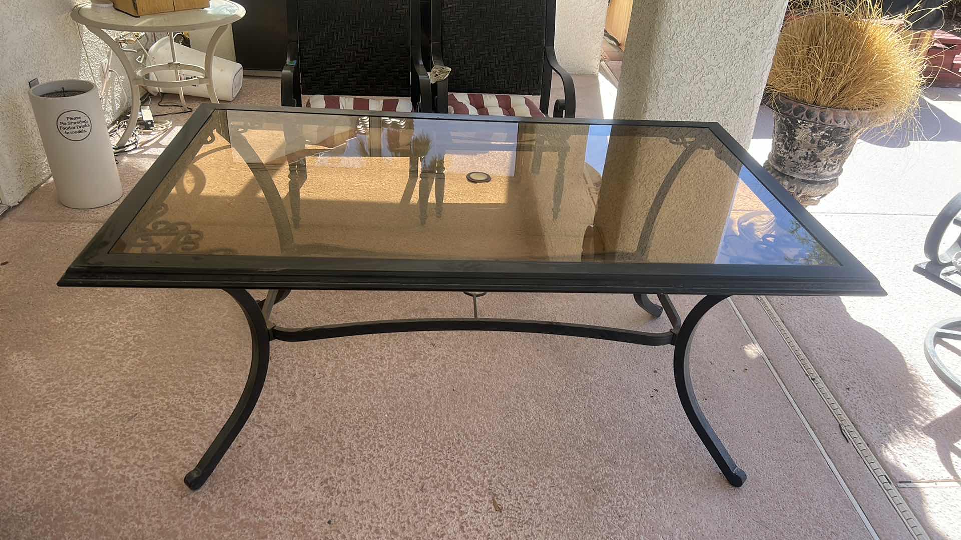 Photo 1 of TINTED GLASS TOPPED OUTDOOR METAL PATIO TABLE 68“ X 40“ X  H29 1/2 “
