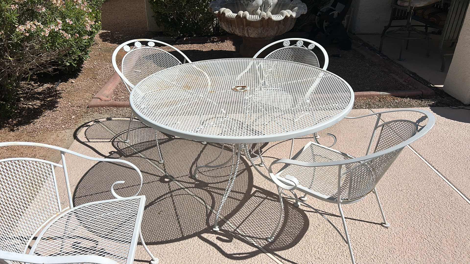 Photo 1 of VINTAGE METAL OUTDOOR PATIO TABLE  4‘ x H29 1/2“AND 4 CHAIRS