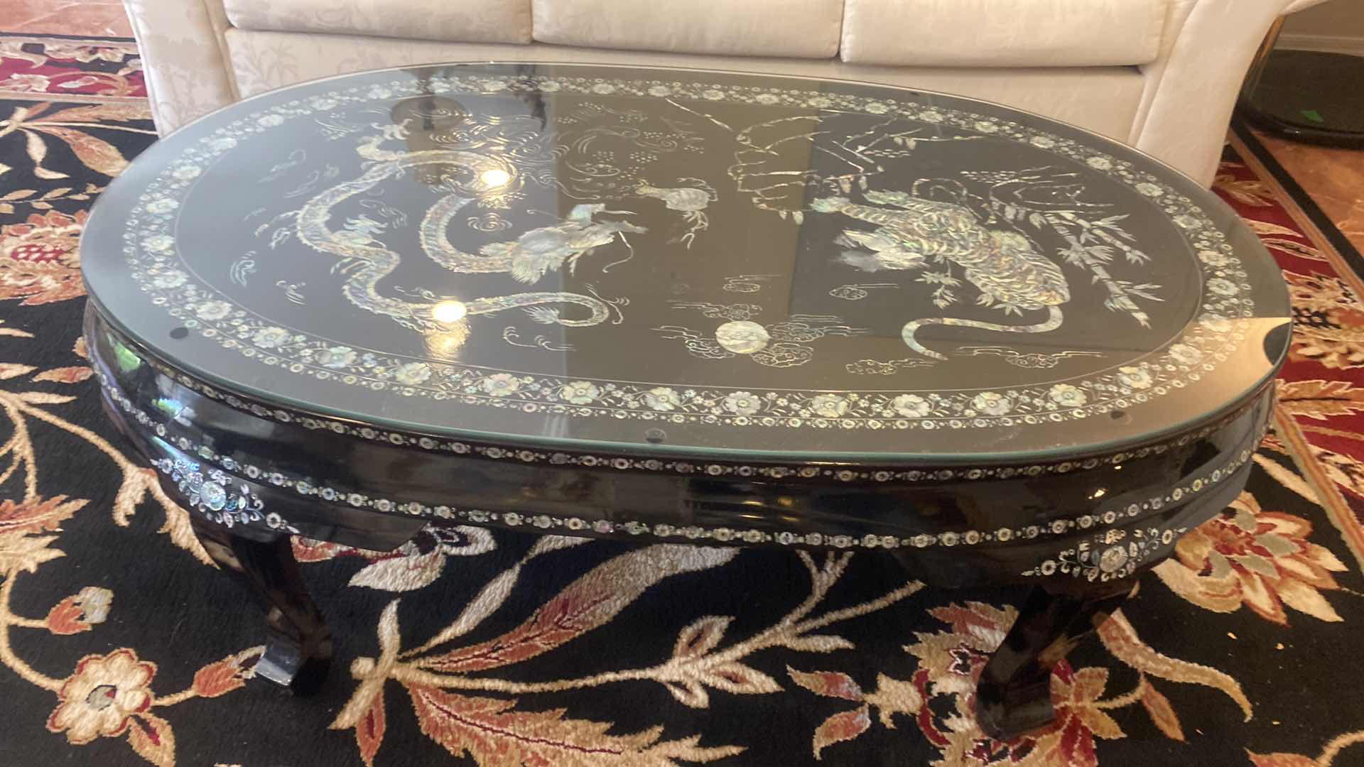 Photo 1 of KOREAN BLACK LACQUER TRADITIONAL COFFEE TABLE WITH MOTHER OF PEARL TIGER  & DRAGON MOTIF 52 1/2“ x 31“ H 18 1/2”