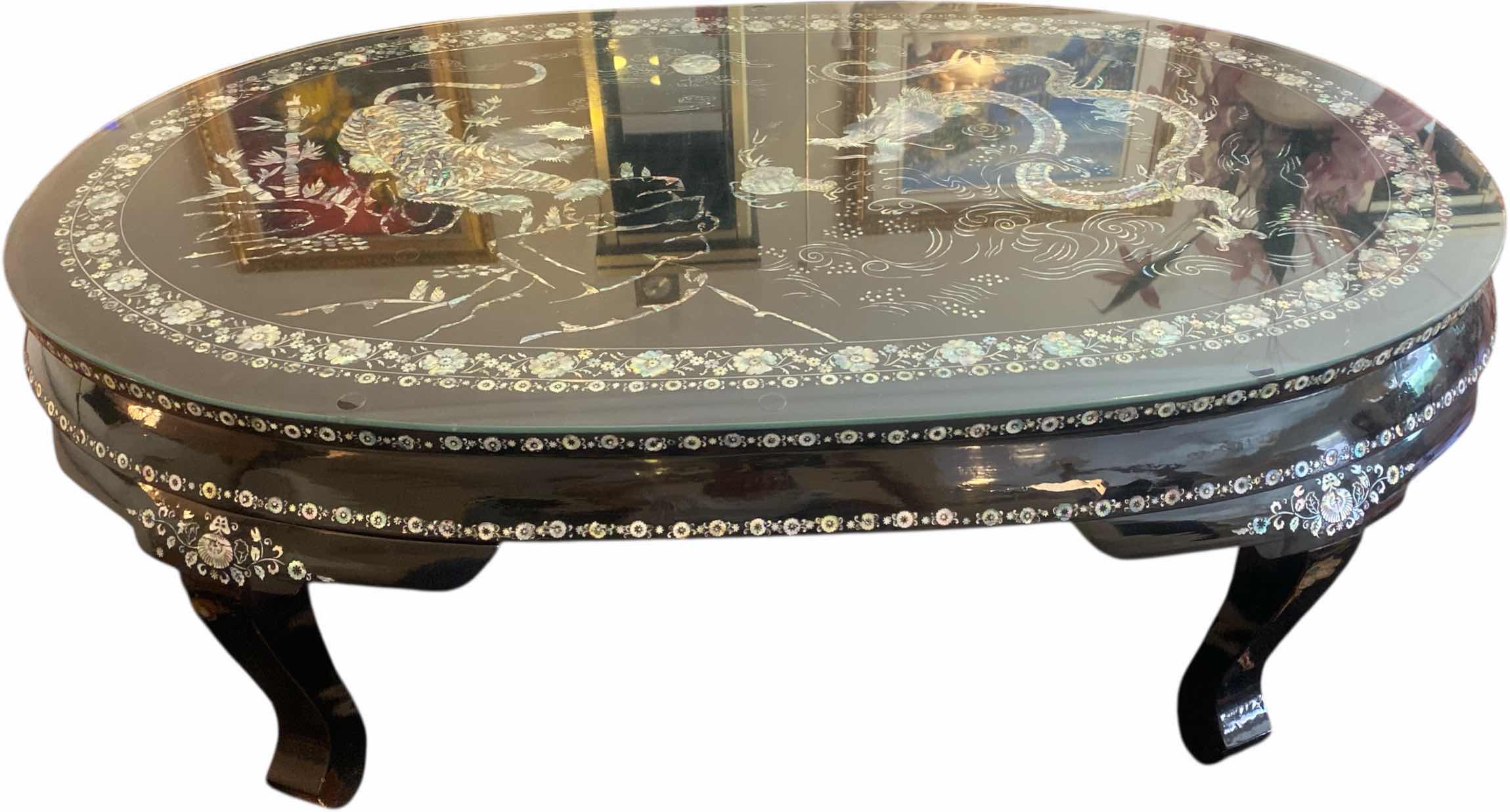 Photo 1 of KOREAN BLACK LACQUER TRADITIONAL COFFEE TABLE WITH MOTHER OF PEARL TIGER  & DRAGON MOTIF 52 1/2“ x 31“ H 18 1/2”