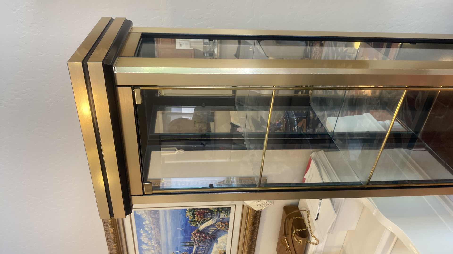 Photo 1 of GOLD & BLACK LIGHTED 2 DOOR DISPLAY CABINET W 3 ADJUSTABLE GLASS SHELVES 18 1/2” x 14” H 72” (two available each sold separately)