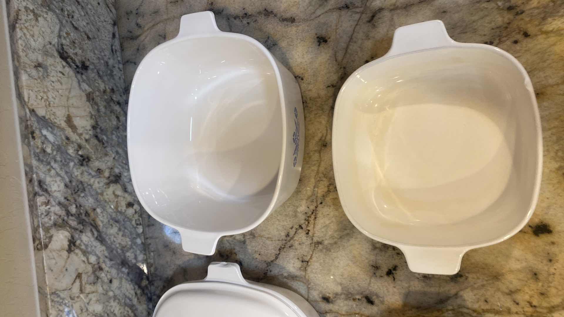 Photo 1 of CORNINGWARE 6 PIECE SET (handle is chipped on back left covered casserole)