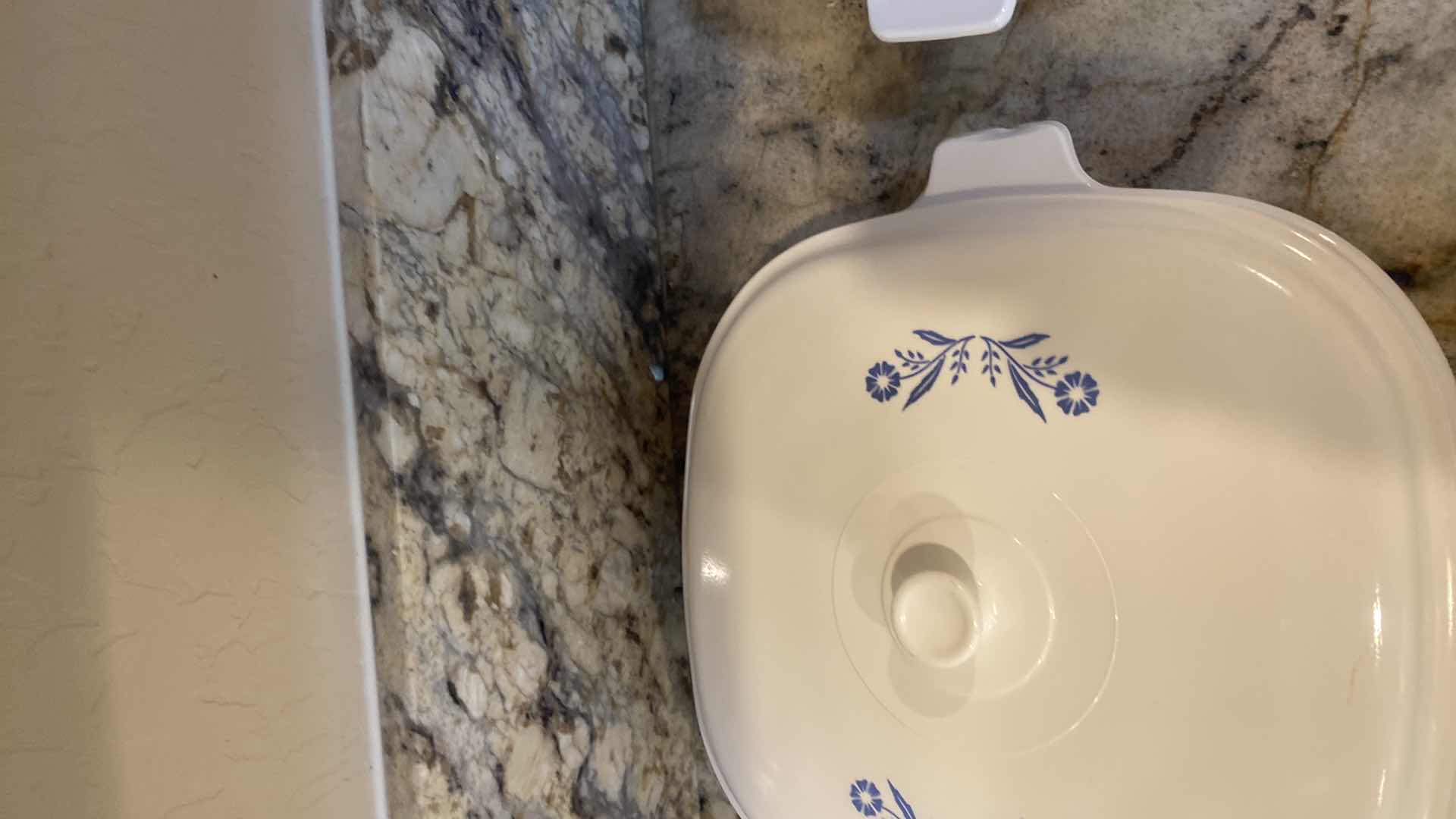 Photo 1 of CORNINGWARE 6 PIECE SET (handle is chipped on back left covered casserole)