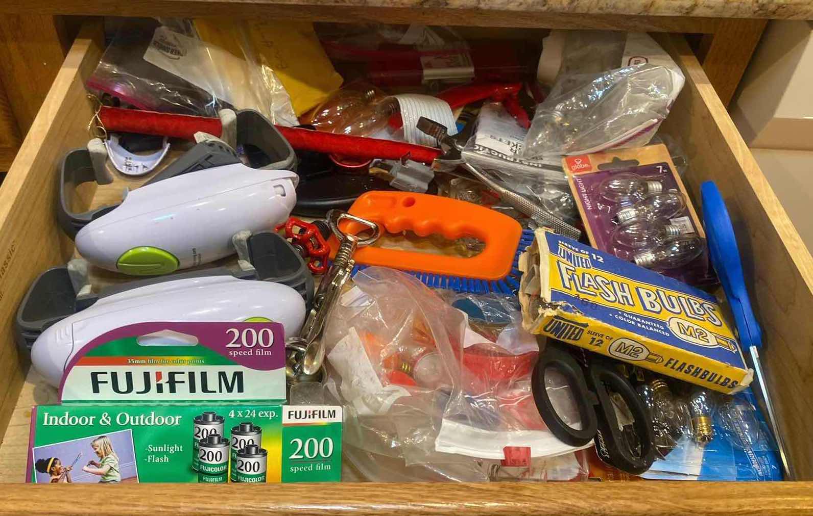 Photo 1 of CONTENTS OF CABINET - JAR OPENERS FIL BULBS & MORE