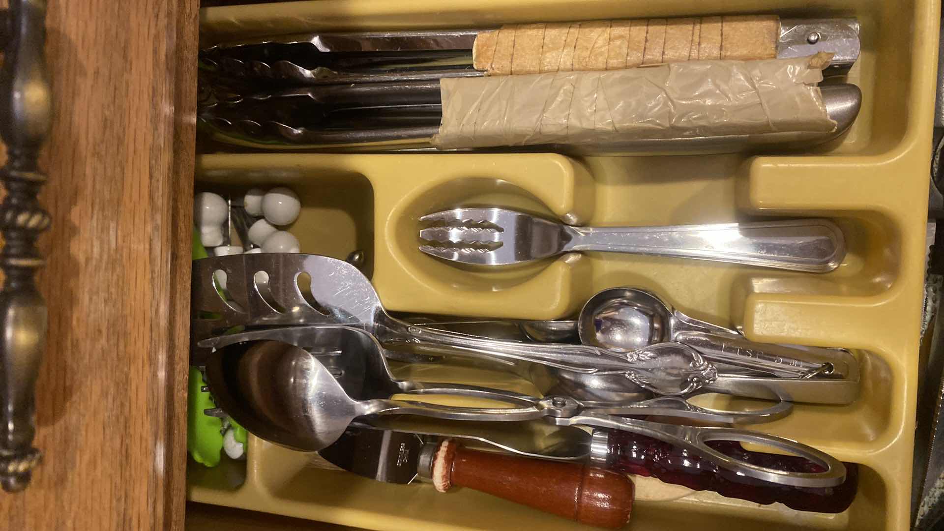 Photo 1 of CONTENTS OF CABINET - KNIVES TONGS & SERVE