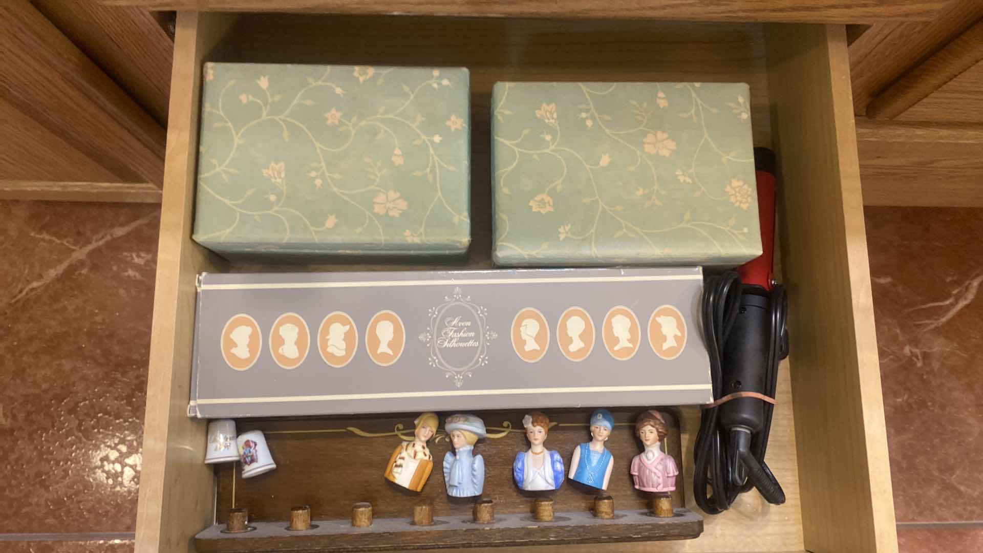 Photo 1 of CONTENTS OF DRAWER - AVON THIMBLES 3 BIXES & CURLING IRON