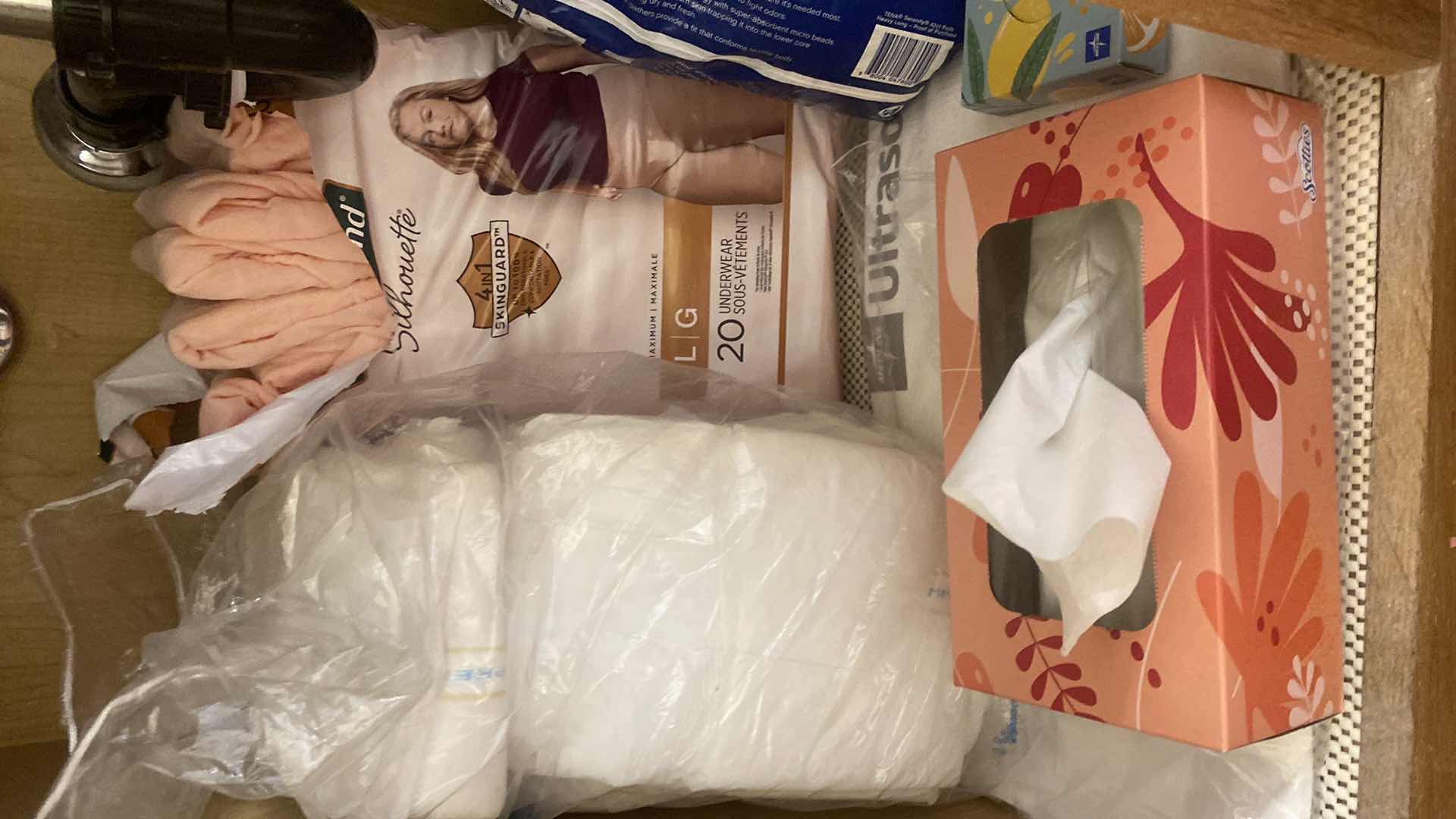 Photo 1 of CONTENTS IN CABINET - WOMENS PERSONAL CARE & KLEENEX