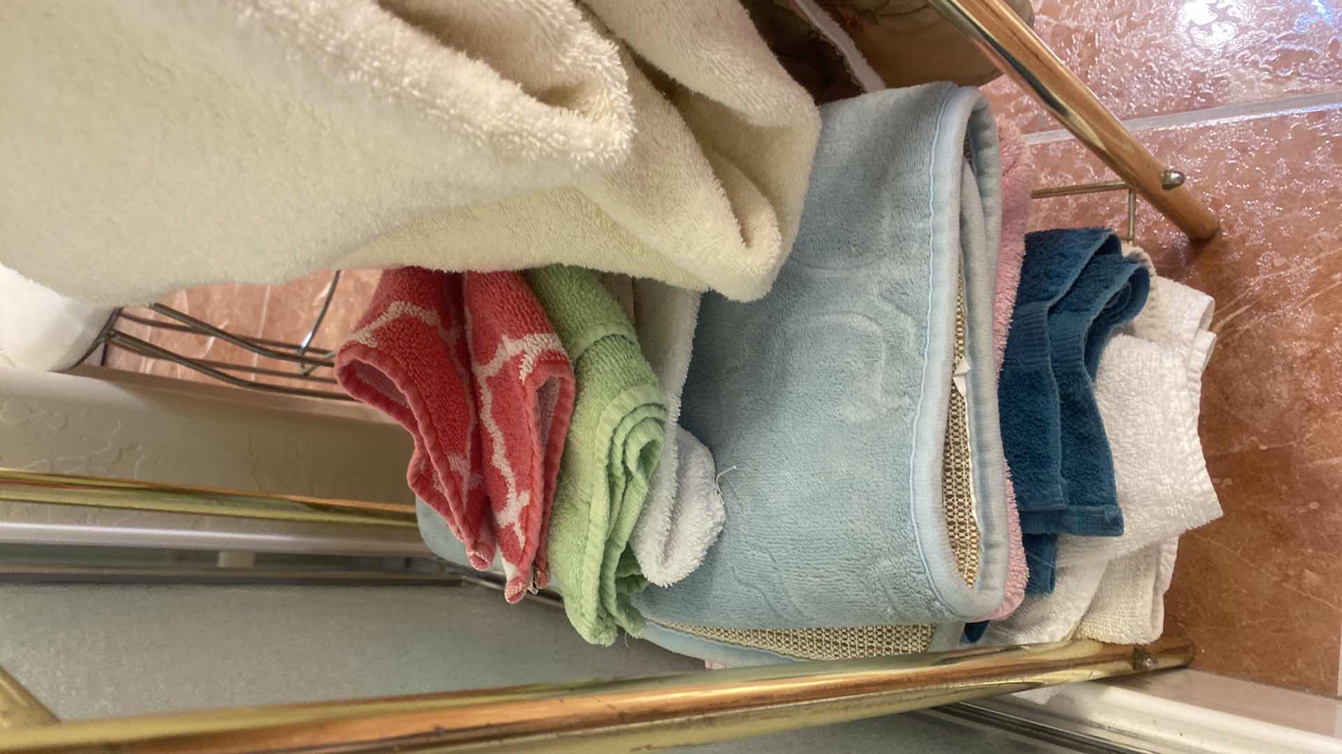 Photo 1 of LIGHT BRASS COLOR COMFORTER HOLDER & TOWELS